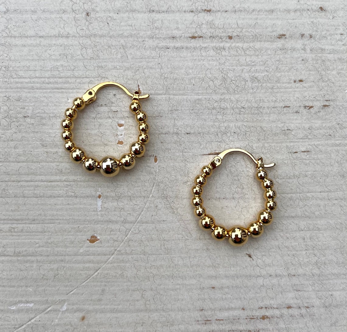 gold hoops with diamond balls