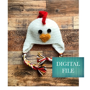 May include: White crocheted chicken hat with a red comb, yellow beak, and black button eyes. The hat has long, braided ties with red, white, black, and yellow yarn.