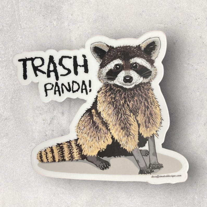 May include: A sticker featuring a cartoon raccoon with the text "Trash Panda!" printed in black on a white background.