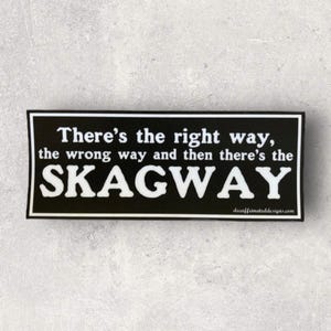 May include: Black and white sticker with the text "There's the right way, the wrong way and then there's the SKAGWAY" on a black background.
