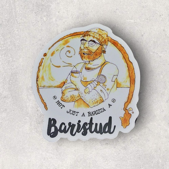 “Baristud” Vinyl Sticker – 4x4 Inches
Show off your coffee expertise and confidence with the “Baristud” sticker! Inspired by years behind the coffee counter and that classic question—“Are you a baristo?”—this 4x4 vinyl sticker lets everyone know you’re not just a coffee pro; you’re a baristud. Durable and made to withstand extreme temperatures, spills, and countless coffee runs, this sticker is also dishwasher-safe. Perfect for your favorite mug, thermos, laptop, or anywhere you want to showcase your barista skills and undeniable charm!