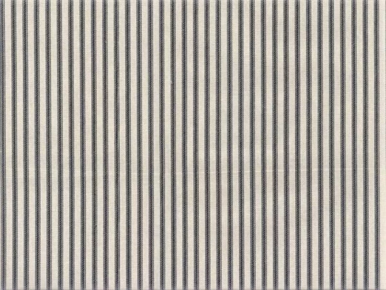 May include: A white fabric with thin black stripes. The fabric has a subtle texture.