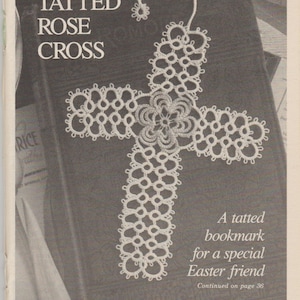 May include: A white crocheted bookmark in the shape of a cross with a rose design in the center. The bookmark is laying on a dark brown book with the text "TATTED ROSE CROSS" printed on the cover. The text "A tatted bookmark for a special Easter friend" is printed below the bookmark.