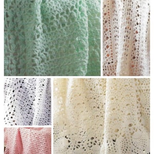 May include: Four crocheted baby blankets in different colors: green, white, cream, and pink. The blankets are made with a delicate openwork pattern.