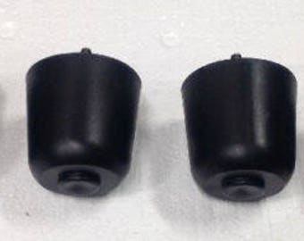 May include: Four black rubber furniture feet with a screw in the center of each foot.