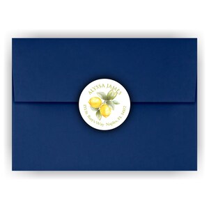 May include: A white round sticker with a lemon illustration and the text "ALYSSA JAMES 131 St. Bar's Way Naples, FL 34102"