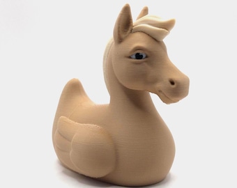May include: A tan-colored hybrid figurine, blending the form of a duck and a horse. The sculpture features a horse's head with detailed eyes and a duck's body with wing details. The overall design is smooth with visible layer lines.