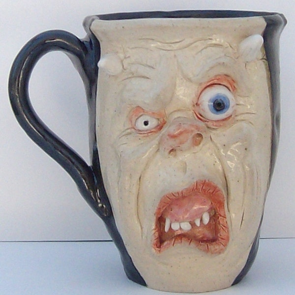 Horned Zombie Face Mug with bloodshot eyes black glaze