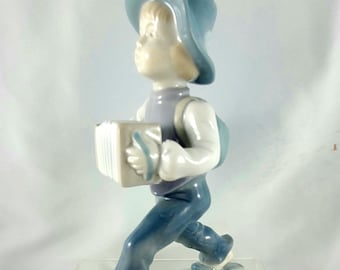 Mid-Century East German Porcelain Figurine of an Accordion Player signed Metzler & Ortloff