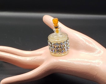 1950s mini glass perfume bottle with rhinestone accent and an orange bottle stopper / acrylic or bakelite