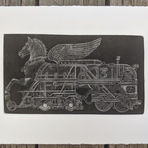 May include: A black and white print of a winged horse pulling a train. The train has the number "13" on the side.
