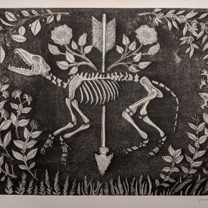May include: A black and white woodcut print of a skeletal dog with an arrow through its body. The dog is surrounded by flowers and leaves. The print is signed "Vanessa Ogle" and dated "2019".