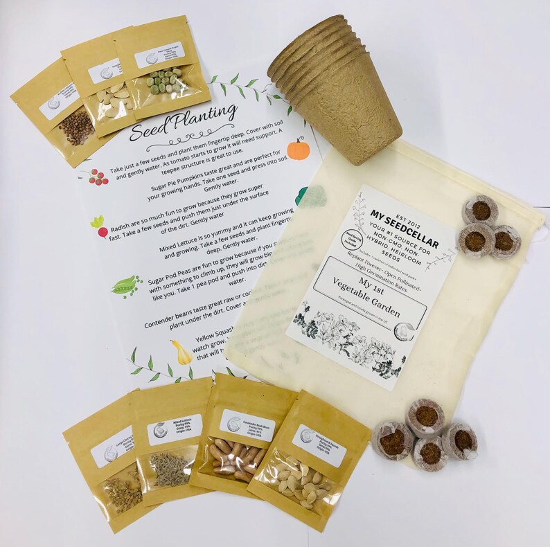 May include: A set of gardening supplies for starting a vegetable garden. The set includes a variety of seeds, peat pots, and a small burlap bag with the text "My Seed Cellar" printed on it. The text "My 1st Vegetable Garden" is also printed on the bag.