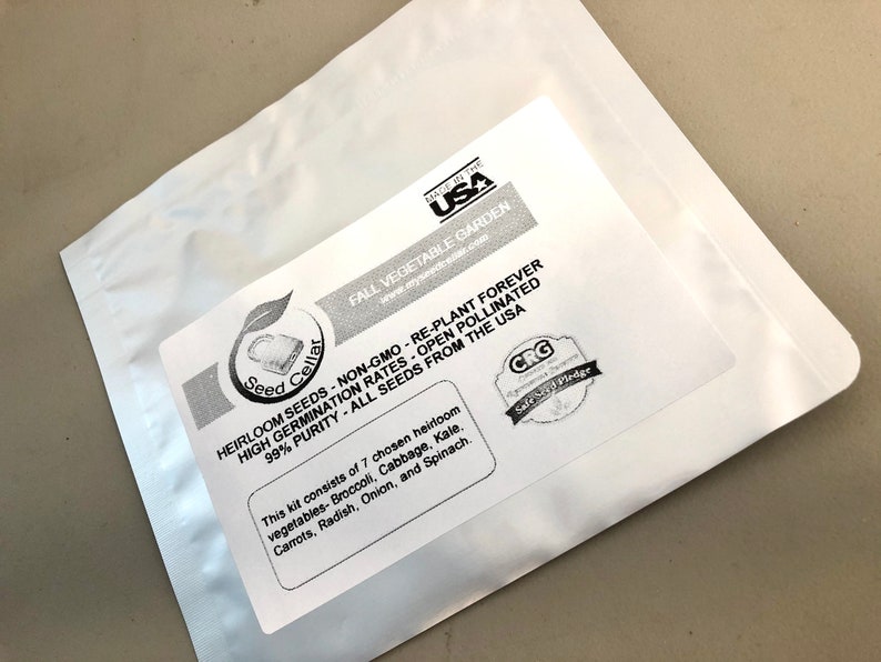 May include: A white resealable pouch with a label that reads "Seed Cellar" and "HEIRLOOM SEEDS NON-GMO - RE-PLANT FOREVER HIGH GERMINATION RATES - OPEN POLLINATED 99% PURITY - ALL SEEDS FROM THE USA". The label also lists the contents of the pouch: "This kit consists of 7 chosen heirloom vegetables - Broccoli, Cabbage, Kale, Carrots, Radish, Onion, and Spinach."