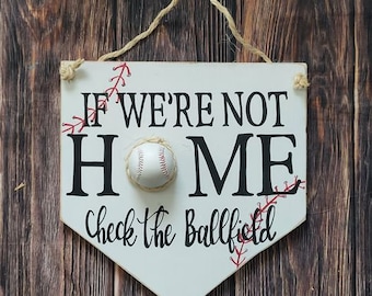 if we're not home check the ballfield door hanger, baseball door hanger