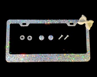 Dazzling Bling license plate frame with chunky iridescent silver glitter with a large white bow diamond holder screw caps bedazzled