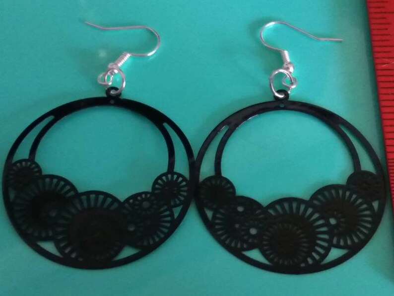 Decorative black hoop earrings