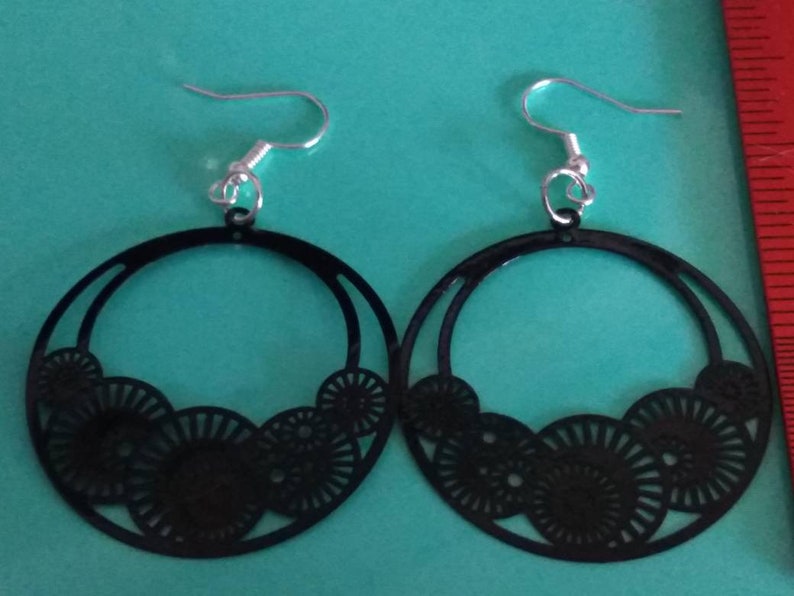 Decorative black hoop earrings