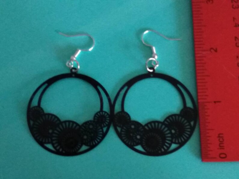Decorative black hoop earrings