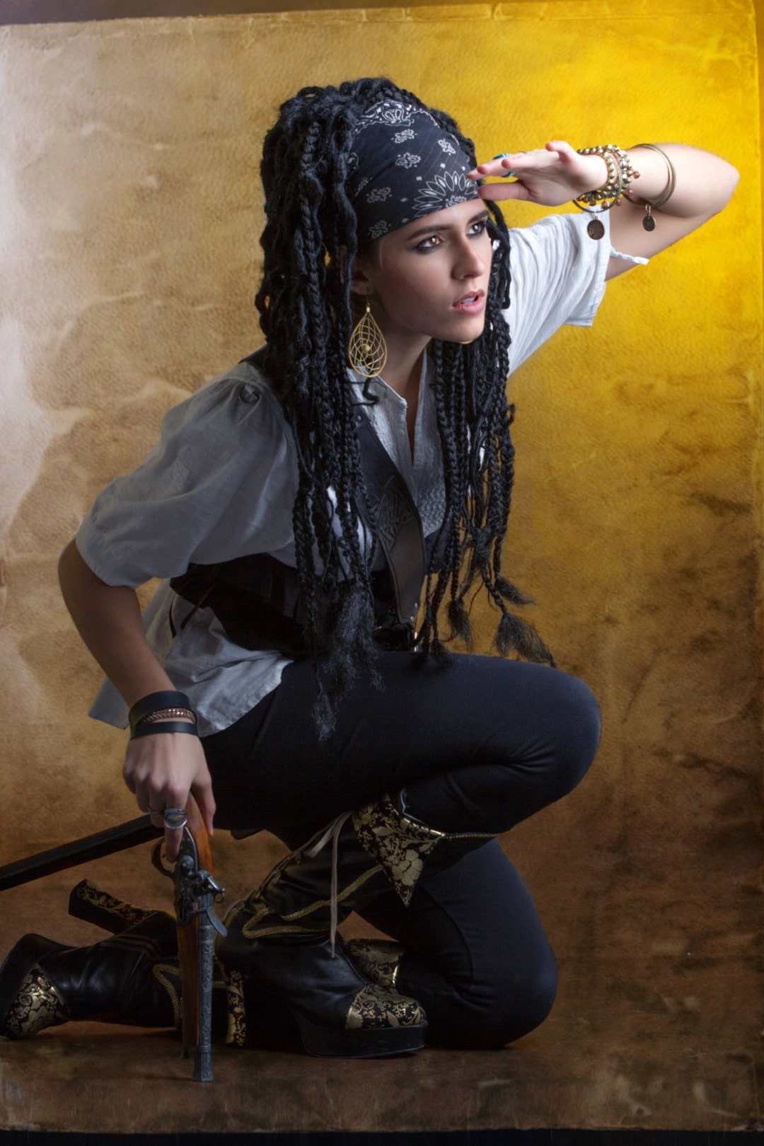 A cosplay character with dreadlocks hair