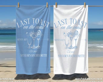 May include: Two beach towels with the text "Last Toast on the Coast" in white. The towel on the left has a washed denim background and the towel on the right has a white background. Both towels feature a blue illustration of three cocktails and the text "Siesta Key" and "Est 2025 Saylor's Bachelorette".