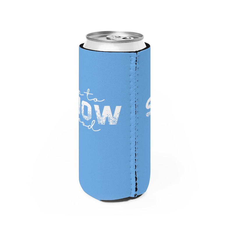 May include: A light blue can cooler with the text "Let it snow" in white. The cooler has a zippered seam on the side.
