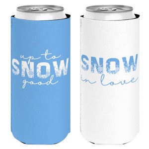 May include: Two white can coolers with blue text. One cooler says "up to snow good" and the other says "snow in love".