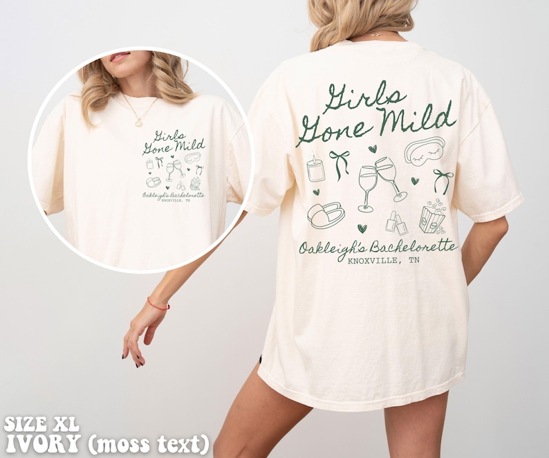 May include: A white t-shirt with a green graphic that says "Girls Gone Mild" and includes illustrations of wine glasses, a sleep mask, and other party favours. The text "Oakleigh's Bachelorette Knoxville, TN" is also included on the shirt.