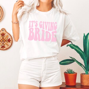 Gift for Bride, Funny Bride Shirt, Engagement Gift, Its Giving Bride, Retro Groovy Bride Tee, Funny Bride gift, Bachelorette Gift for Bride White