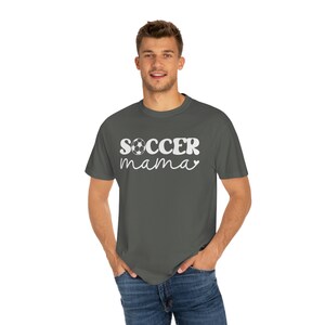 May include: A dark gray t-shirt with the text "SOCCER mama" in white with a soccer ball graphic.