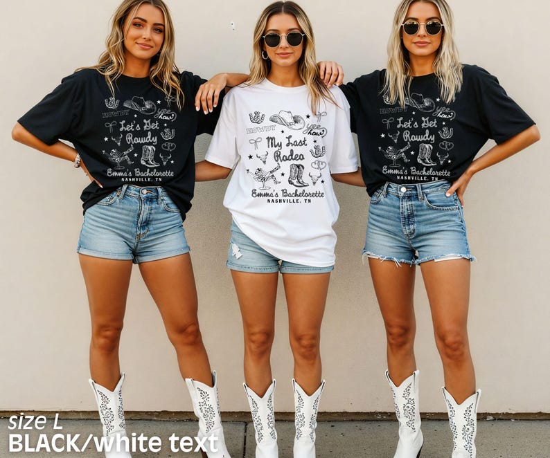 May include: Three women wearing black and white t-shirts with a western theme. The shirts feature a cowboy hat, boots, and the text "Let's Get Rowdy" and "My Last Rodeo". The women are wearing denim shorts and white cowboy boots.