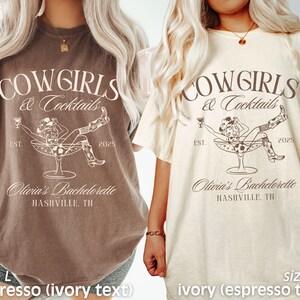 May include: Two brown and ivory t-shirts with the text "COWGIRLS & Cocktails" and a cowgirl drinking from a champagne glass. The text "Olivia's Bachelorette Nashville, TN" is also on the shirts. The shirts are available in sizes L and XL.
