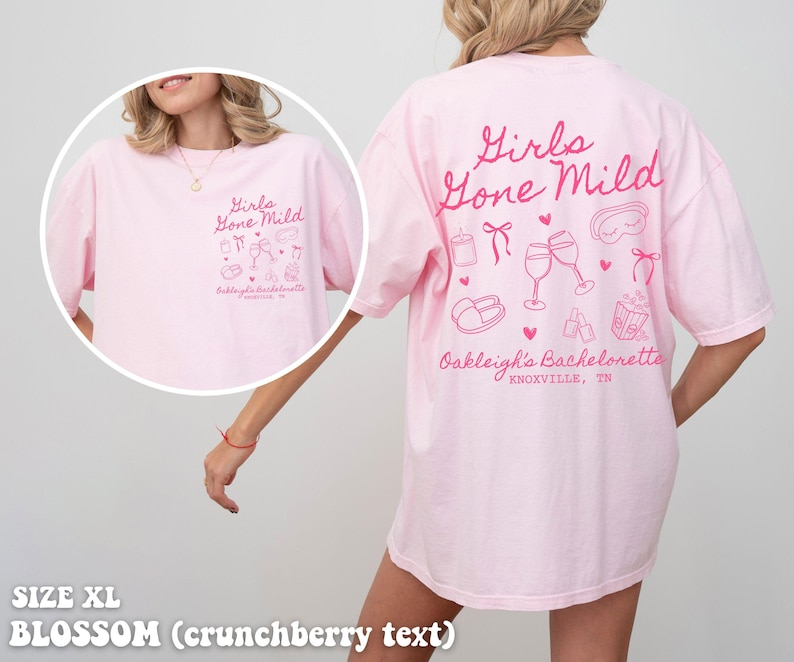 May include: Pink oversized t-shirt with the text "Girls Gone Mild" and a design of various hen party icons. The text "Oakleigh's Bachelorette Knoxville, TN" is printed below the design. The shirt is size XL and the text is in a crunchberry colour.