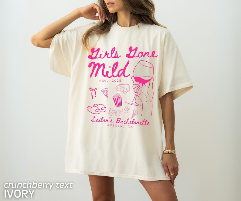May include: Ivory t-shirt with pink text that reads "Girls Gone Mild Est. 2023 Sailor's Bachelorette Austin, TX". The shirt features a pink illustration of a glass of wine, pizza, popcorn, and flip flops.