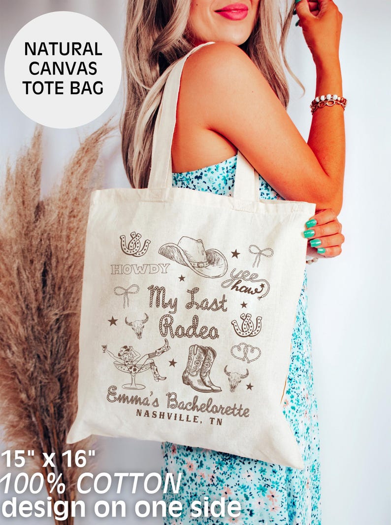 May include: A natural canvas tote bag with a brown design that says "Howdy", "My Last Rodeo", "Yee Haw", and "Emma's Bachelorette Nashville, TN". The bag is 15 inches by 16 inches and is made of 100% cotton.