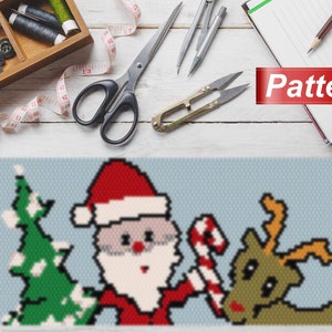 May include: A pixel art pattern of Santa Claus, a Christmas tree, and a reindeer. The pattern is on a blue background and includes the word "Pattern".