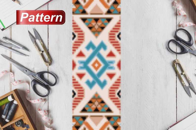 May include: A geometric pattern in teal, orange, and black on a cream background, with the word "Pattern" in a red banner. The image includes sewing tools like scissors and measuring tape. The pattern is surrounded by sewing tools on a white wooden surface.