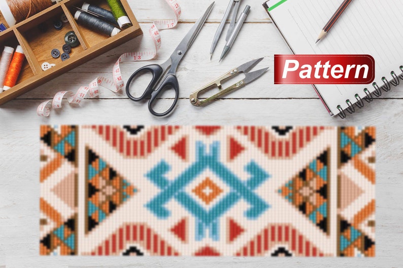 May include: A vibrant geometric pattern featuring red, orange, blue, and black shapes. The word "Pattern" is displayed on a red banner. Sewing tools, including scissors, thread, and a tape measure, are arranged on a white wooden surface.