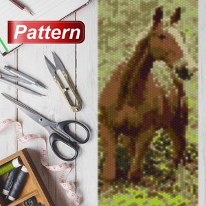 May include: A beaded pattern of a brown horse standing in a field of green grass. The pattern is made with small beads and is suitable for a craft project.