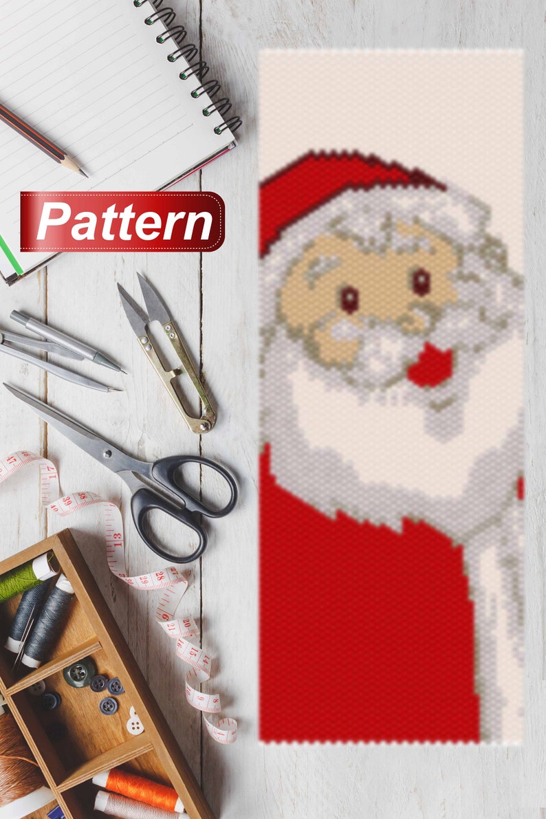 May include: A bead pattern for a Santa Claus ornament. The pattern is made up of red, white, and beige beads. The pattern is for a Santa Claus with a red hat, white beard, and red suit.