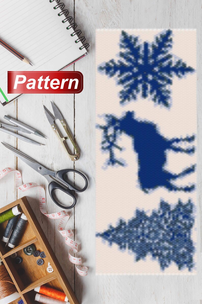 May include: A vertical pattern with three blue designs on a white background. The designs are a snowflake, a reindeer, and a Christmas tree.
