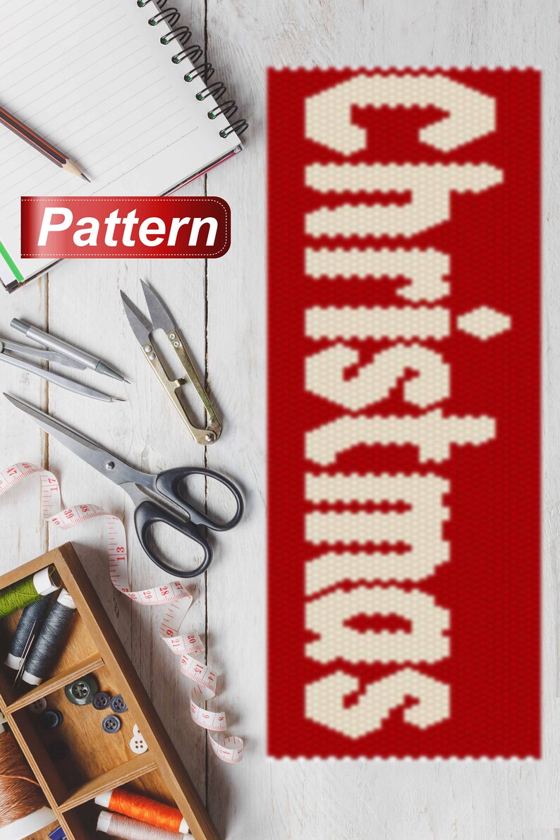May include: A red and white beaded pattern for a Christmas craft project. The pattern is for the word "Christmas" in white beads on a red background.
