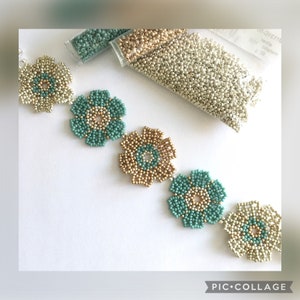 May include: A beaded necklace with a repeating pattern of green and gold flowers. The necklace is made with small seed beads and is strung on a clear thread. The beads are arranged in a circular pattern to create the flower shape. The necklace is shown on a white background.