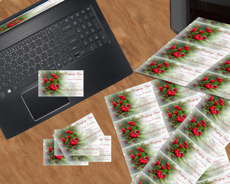 May include: A stack of business cards with a red berry and green leaf design. The text on the cards reads "Your Company Name", "Your Name", "Your Email", "Your Phone Number", and "www.YourWebsite.com".