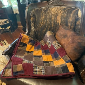 Flannel patchwork quilted throw with fleece back.