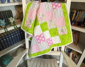 Green and Pink flannel baby or crib quilt.