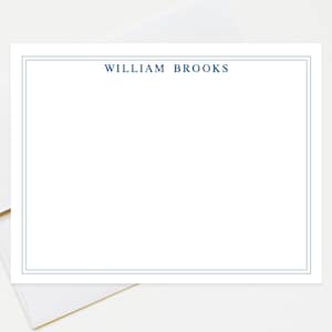 May include: A white card with a blue border and the text "WILLIAM BROOKS" printed in blue at the top.