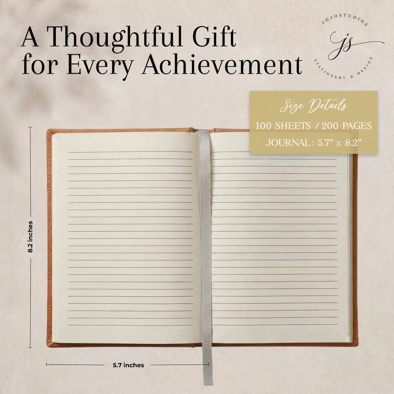 May include: An open journal with tan covers and lined white pages, featuring a gray ribbon bookmark. Text reads: A Thoughtful Gift for Every Achievement, Size Details 100 SHEETS / 200 PAGES, JOURNAL: 5.7 inches by 8.2 inches.