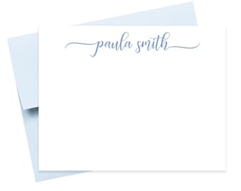 May include: White stationery set with a light blue envelope. The stationery features the name "paula smith" in a delicate, cursive font. The set is ideal for personalized notes and correspondence.