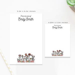 May include: Two white notepads, one 5.5 x 8.5 inches and the other 4.25 x 5.5 inches, feature the text "From the desk of Emily Smith." Both have a floral design at the bottom with the words "SOCIAL WORKER."